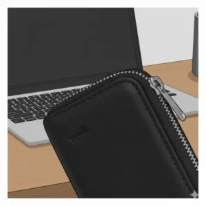 Detailed shot of the high-quality stitching and rich grain of the full-grain leather on the zippered key case.