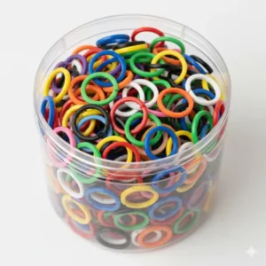 A large variety pack of small plastic colored key rings in a transparent container.