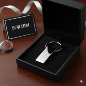Polished silver male keychain presented in a black velvet gift box for birthdays.