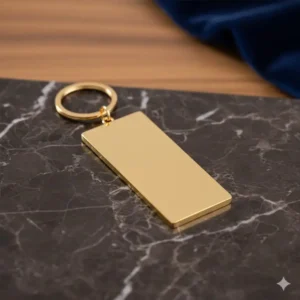 The smooth back of the gold keychain, perfect for detailed custom engraving or stamping.