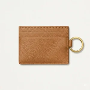 Front view of minimalist black card cases with keychain featuring silver rings and three slots.