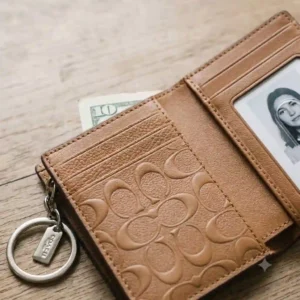 Interior view showing card slots inside a Coach wallet key ring.